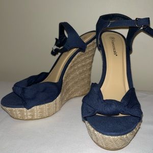 Navy blue espadrille wedges with ankle strap.